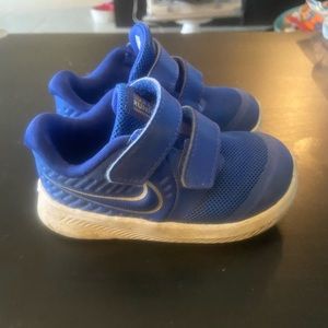 Royal blue toddlers Nike running shoes